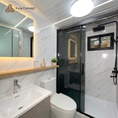 Salle de bain du KAZ Brown : douche vitrée, vasque, WC et miroir rétroéclairé