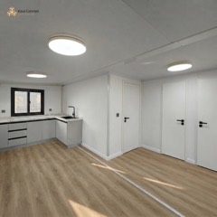 Séjour du KAZ Pepper White avec cuisine en L blanche et accès aux chambres